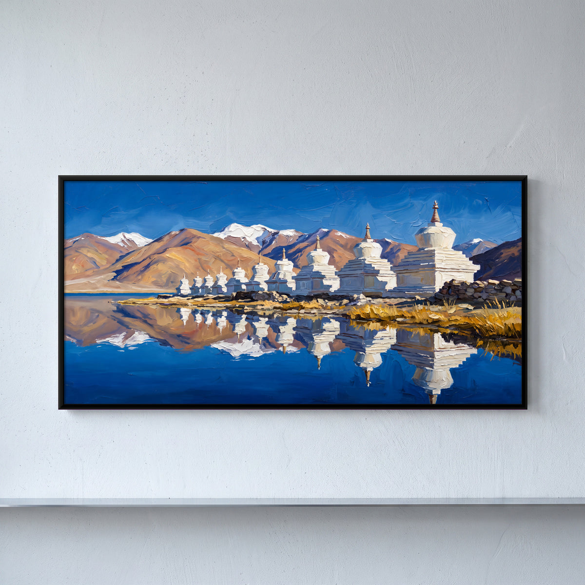 White Stupas by a Mountain Lake - framed canvas art hung on a wall