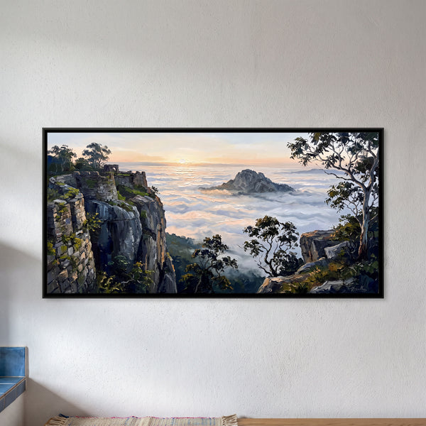 Rocky Cliff Edge Overlooking a Vast Sea of Clouds