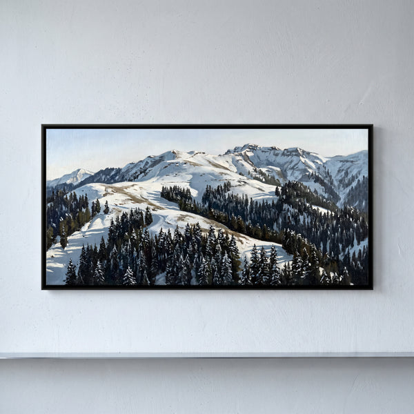 Patchy Snow on a Forested Mountain Ridge