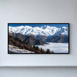 Snow-capped Mountain Range Above Clouds