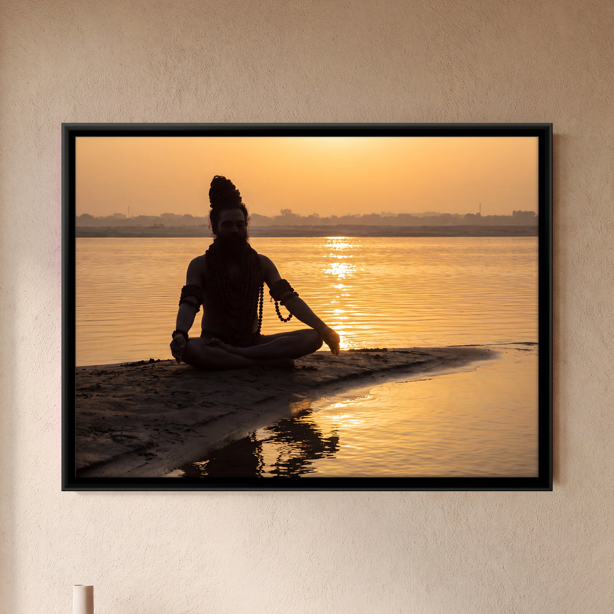 Sadhu Meditating at Sunrise - framed canvas art hung on a wall