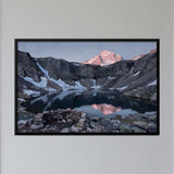 Mountain Lake Reflecting a Sunlit Peak
