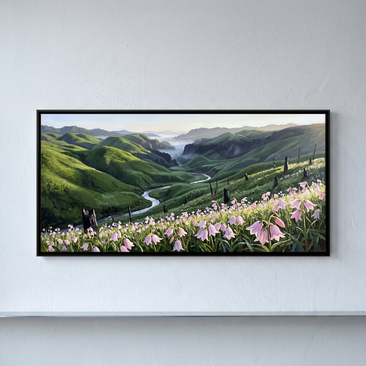 Wild Lilies Above a Green Valley - framed canvas art hung on a wall