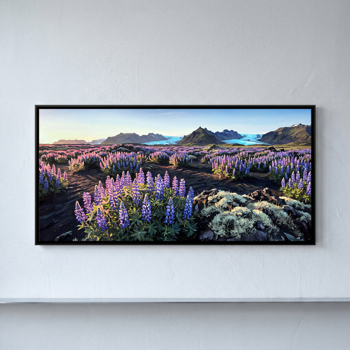 Lupins by a Glacial River - framed canvas art hung on a wall