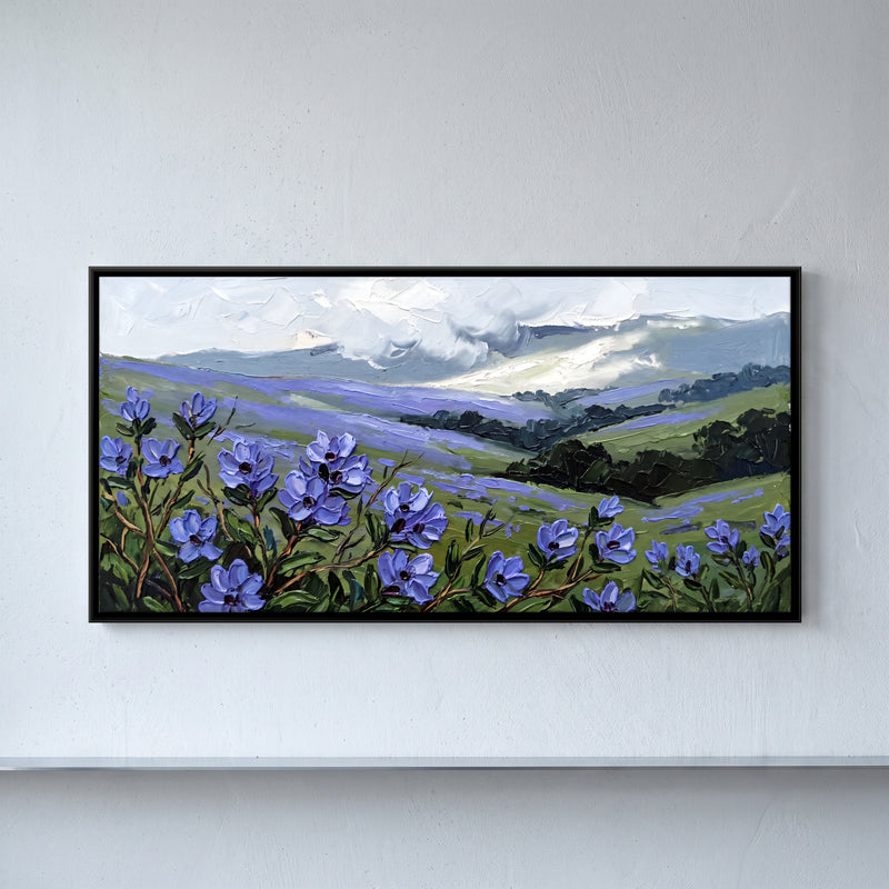Blue Wildflowers on Misty Hills - framed canvas art hung on a wall