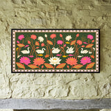 Swans Swimming Among Lotus Flowers