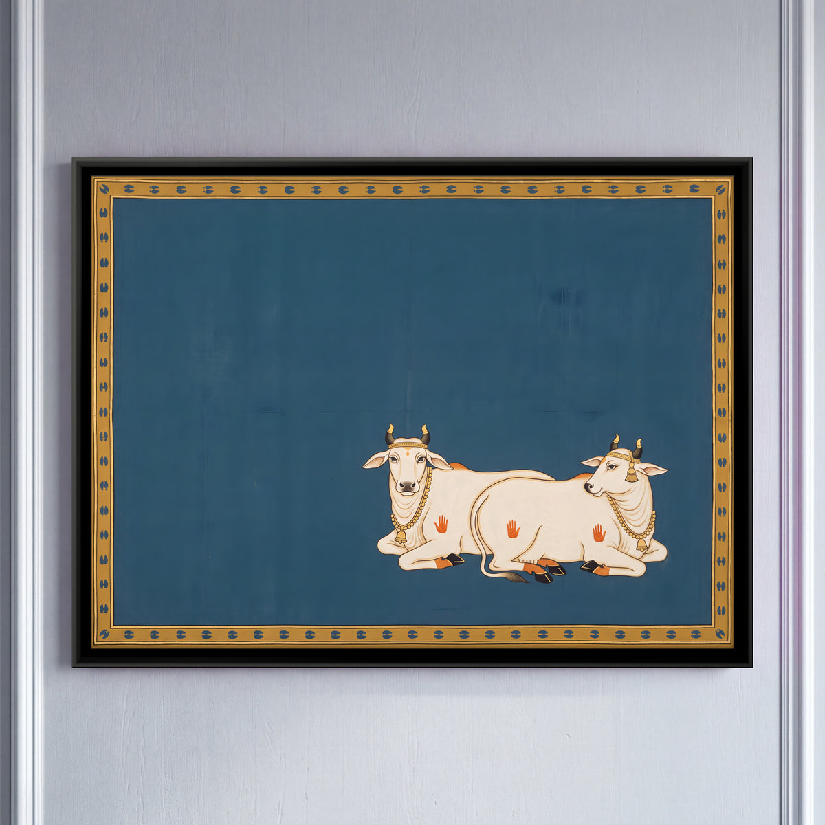 Two Resting Cows - framed canvas art hung on a wall