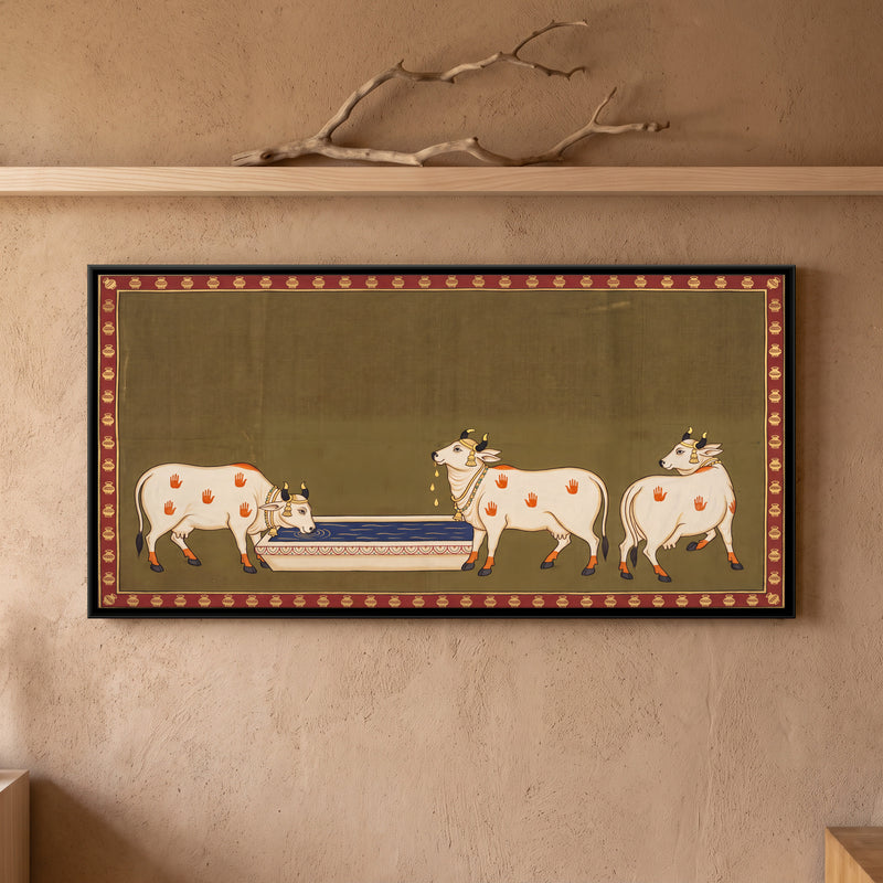 Cows at a Water Trough - framed canvas art hung on a wall