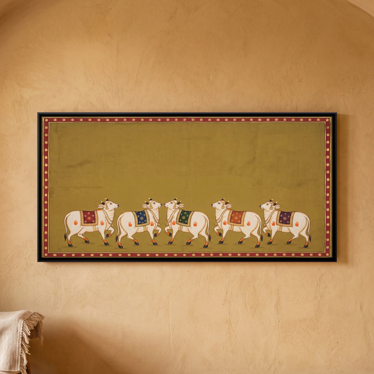 Five Decorated Cows - framed canvas art hung on a wall