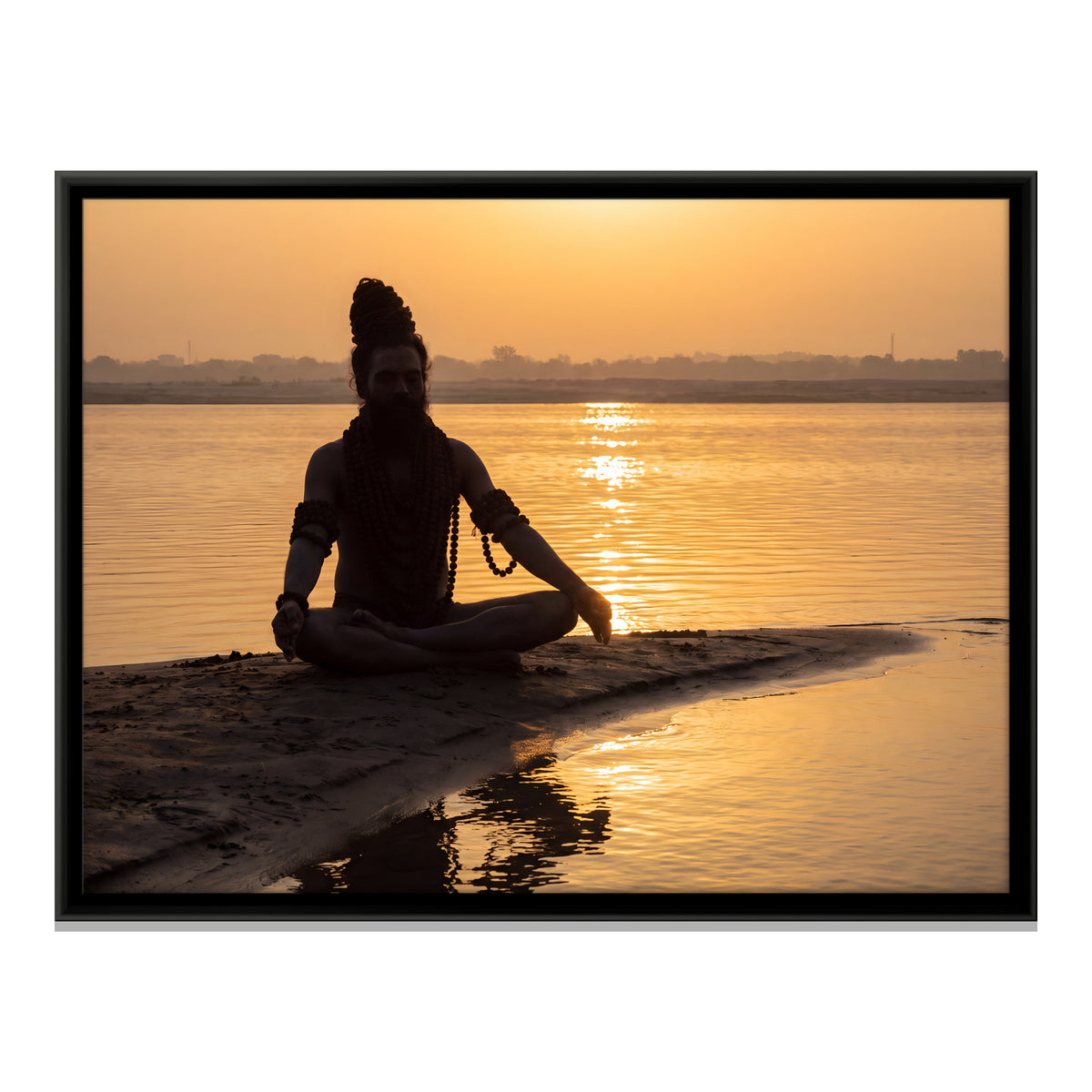Sadhu Meditating at Sunrise - framed canvas print, front view