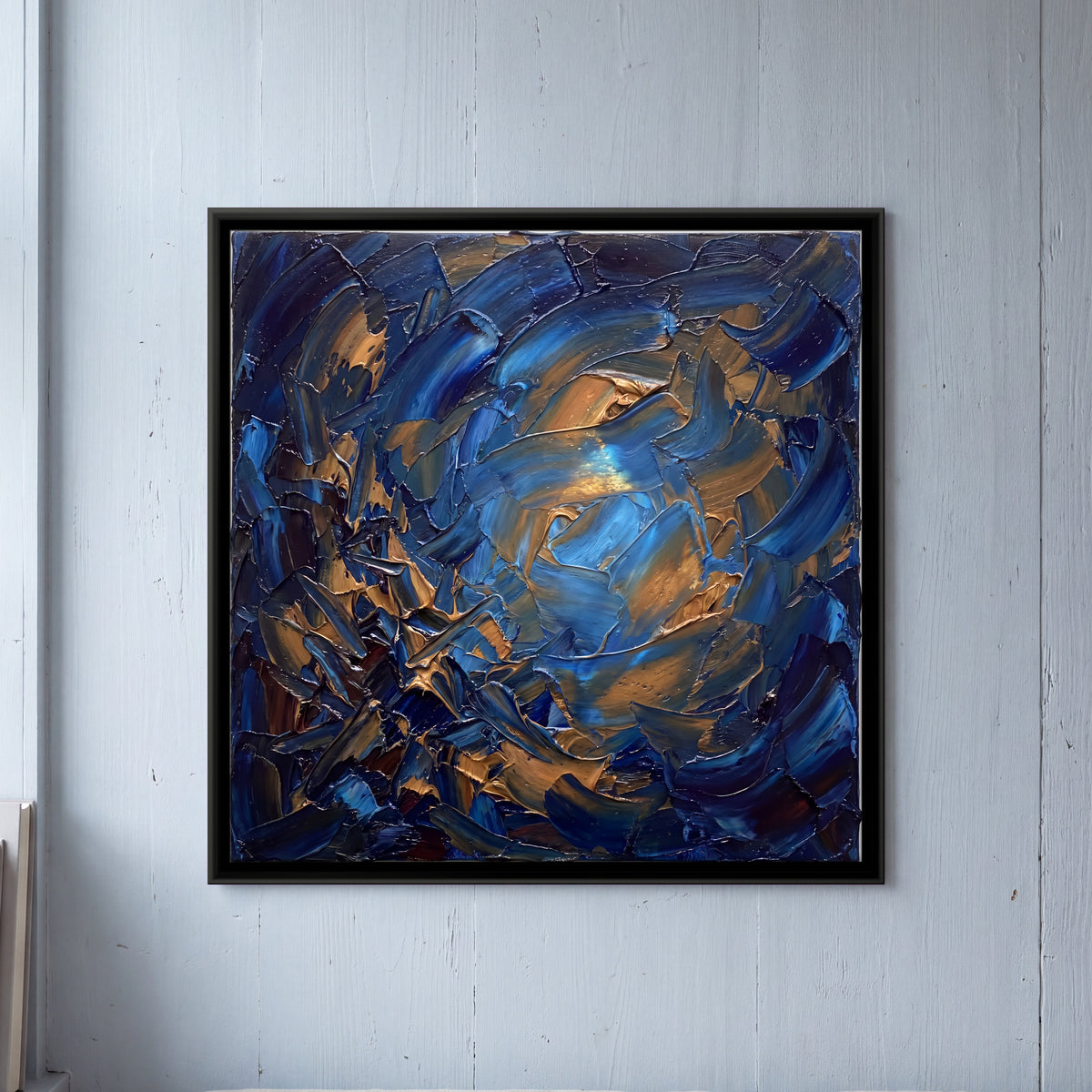 Blue and Copper Burst - framed canvas art hung on a wall