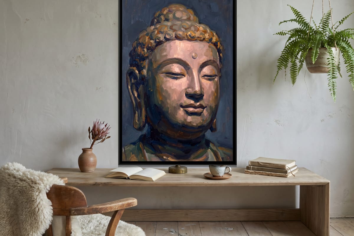 A tall Buddha canvas above a console table on an entryway wall