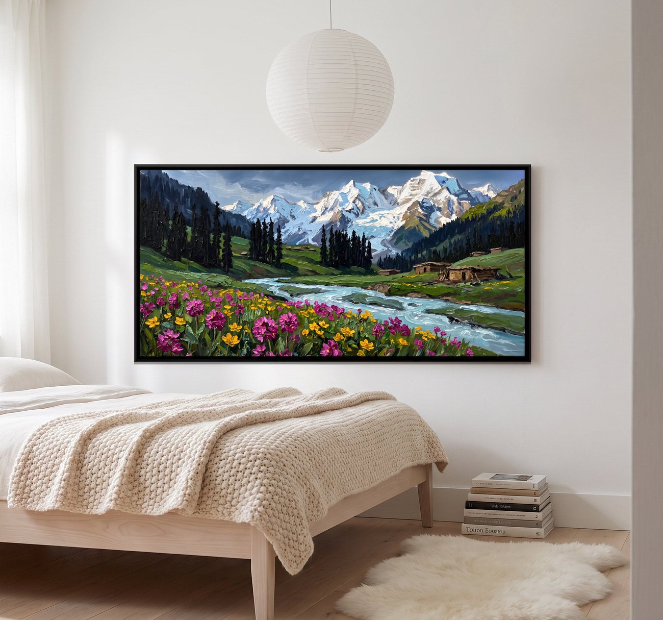 A wildflower meadow below snow peaks canvas above a bed in a pale bedroom